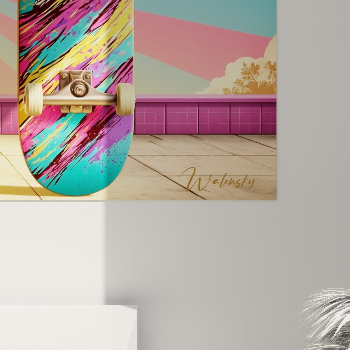 Détail des coulures de peinture rose turquoise et jaune sur la texture imprimée du skateboard