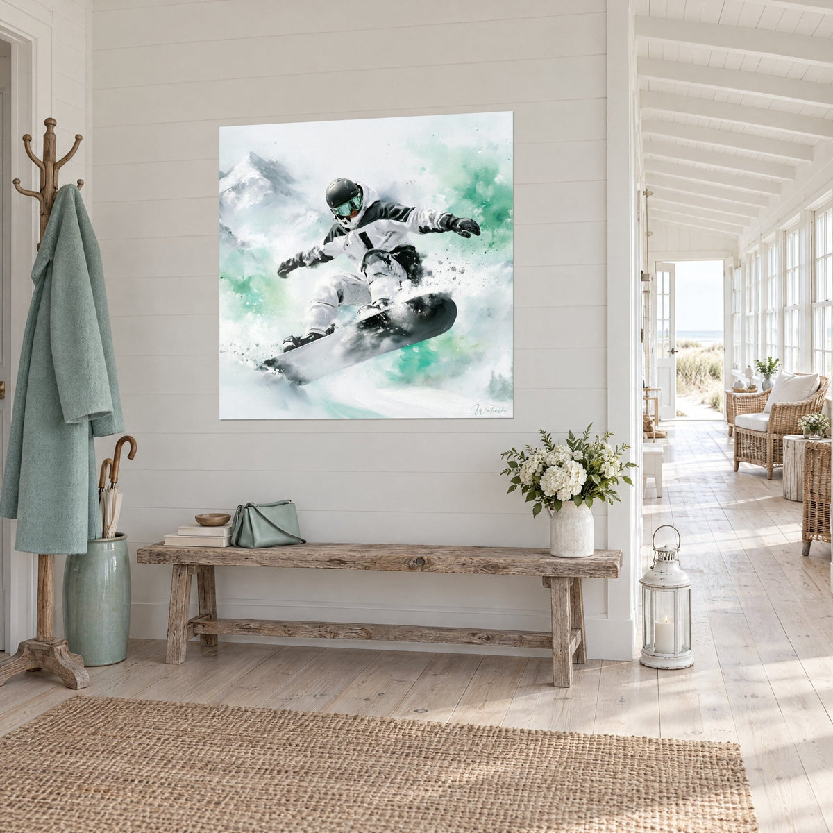 Wall art of a helmeted rider suspended in a spray of white and mint green powder snow, hung in a seaside sunroom