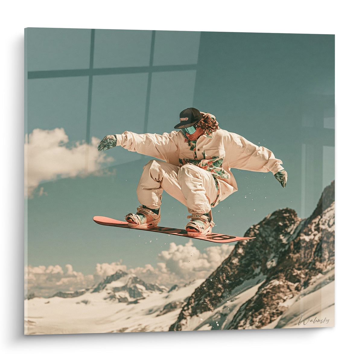 Snowboardeur en combinaison beige suspendu en saut, planche rose et ciel bleu pétrole