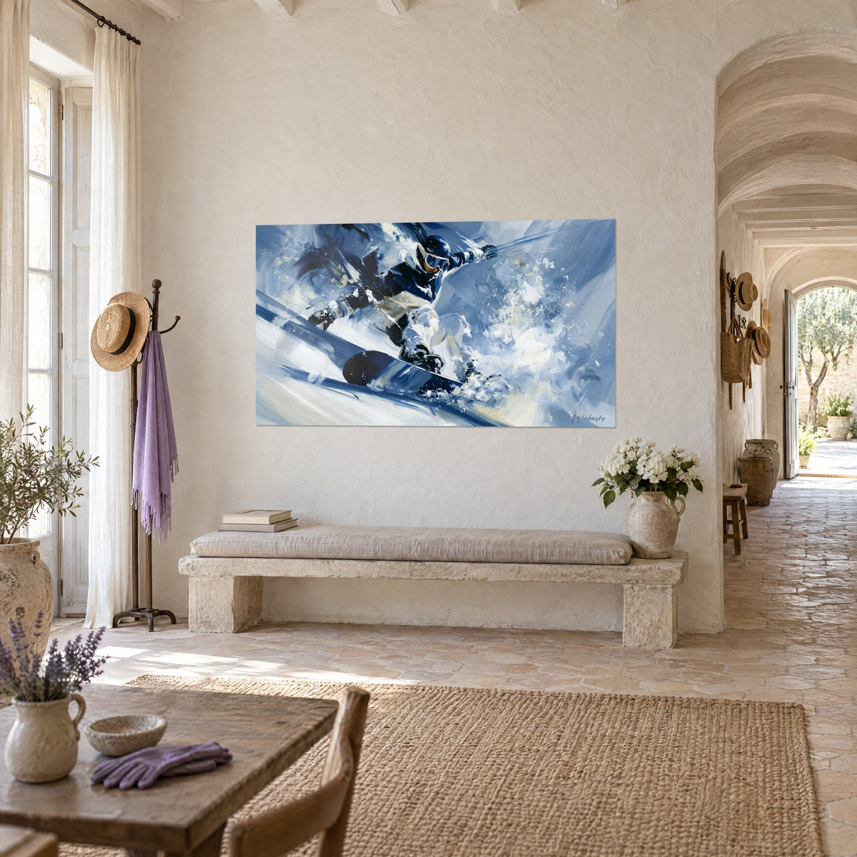 Wall art of a rider carving a turn on a black board splashing, white and blue powder snow, hung in a hallway of a Provençal farmhouse