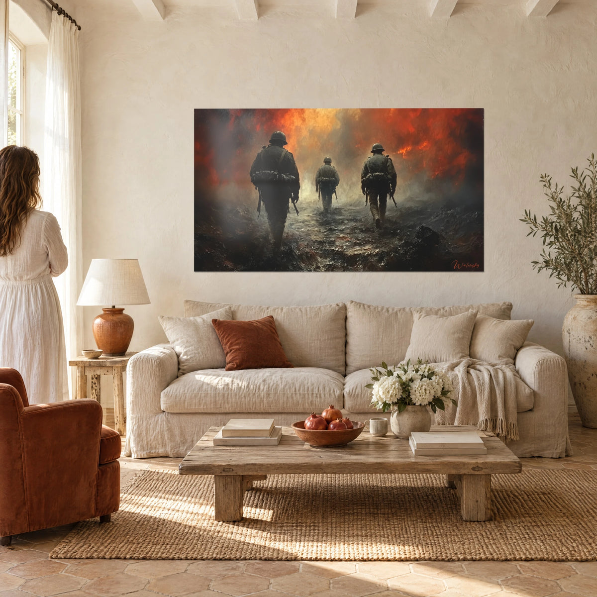 Wall art three helmeted infantrymen marching toward an orange and red blaze, grey smoke, above a sofa in a bright living room