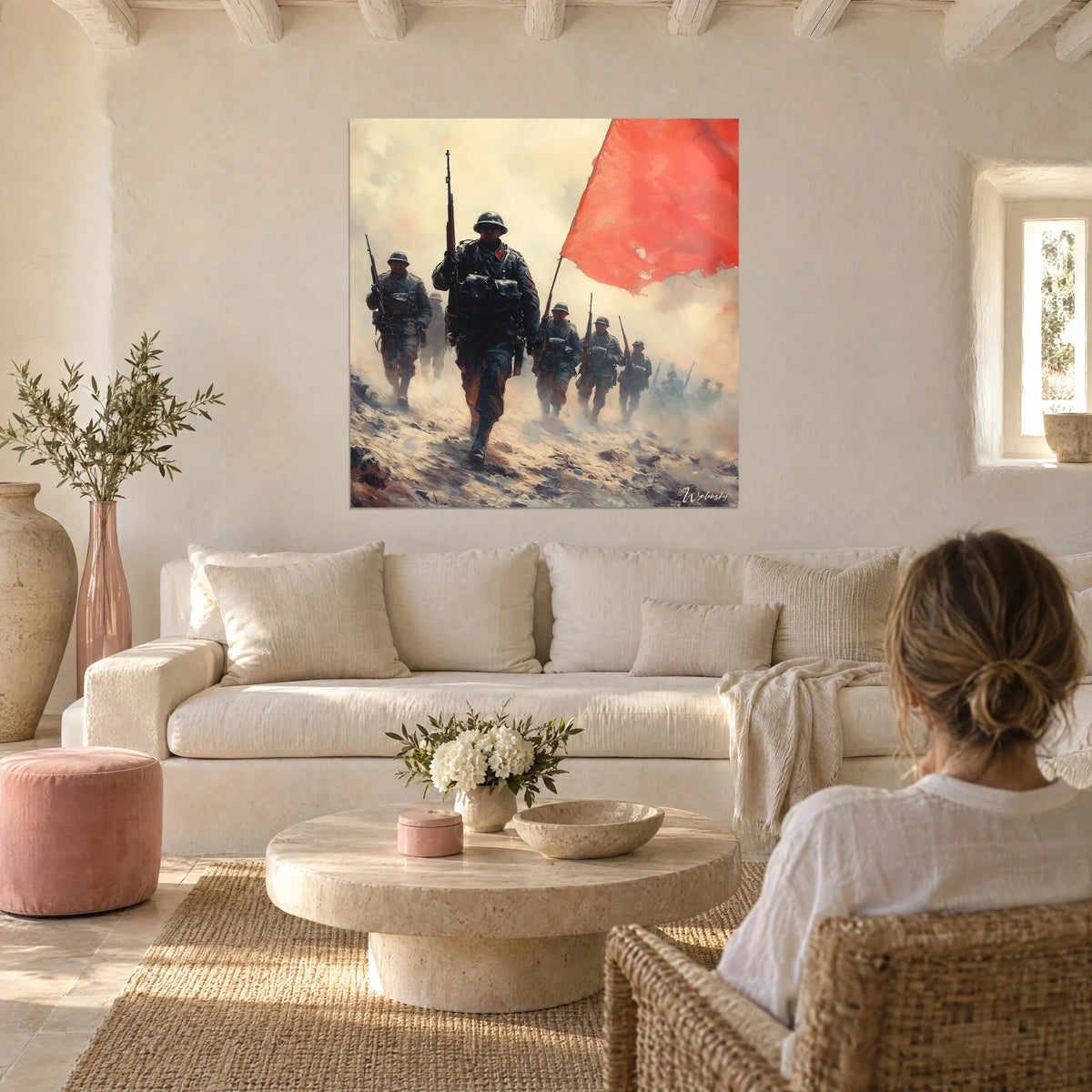 Wall art infantrymen in helmets marching through ochre smoke, huge coral red flag, above a sofa in a bright living room