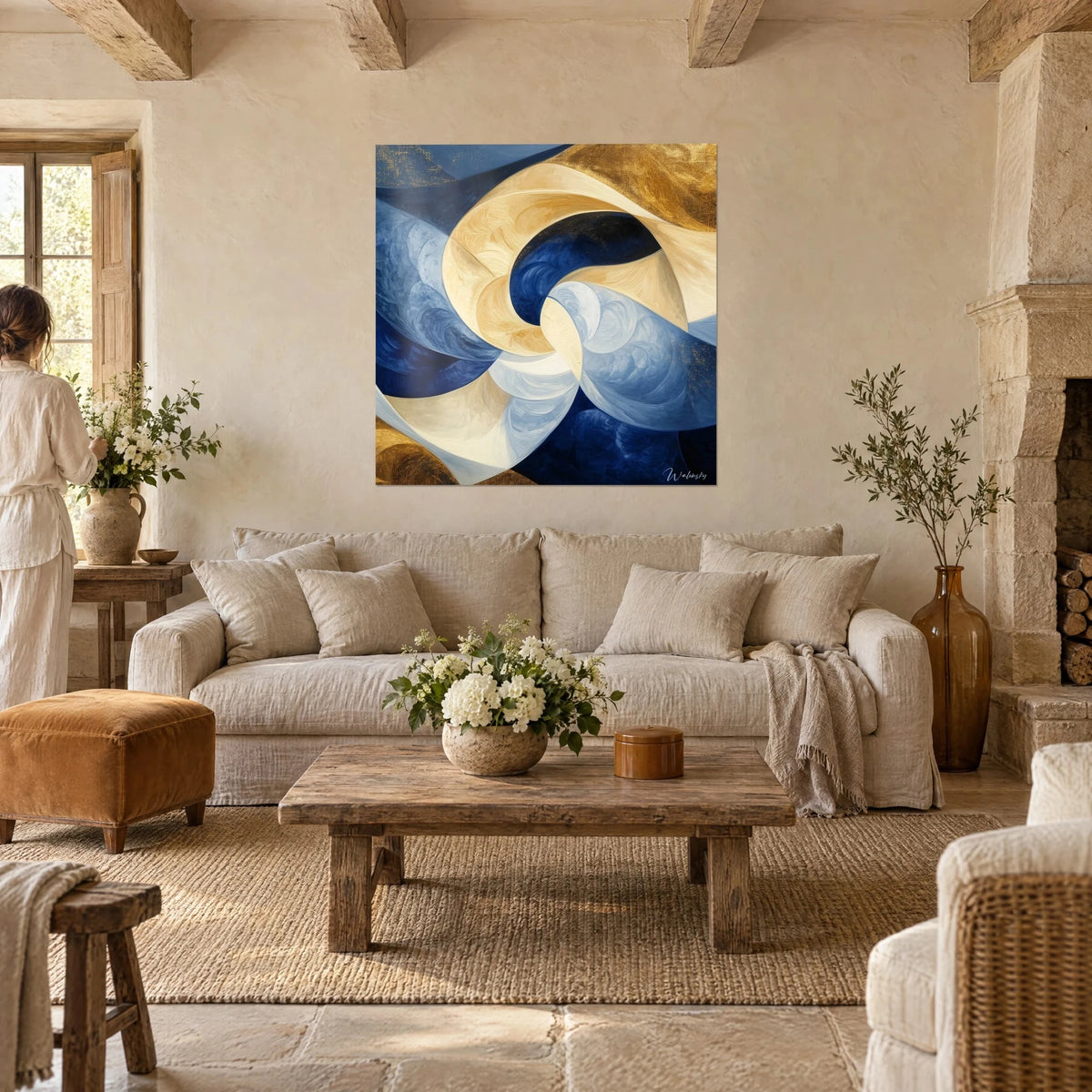 Wall art abstract spiral in midnight blue and ivory, gold touches, two people seen from behind, above a sofa in a bright living room