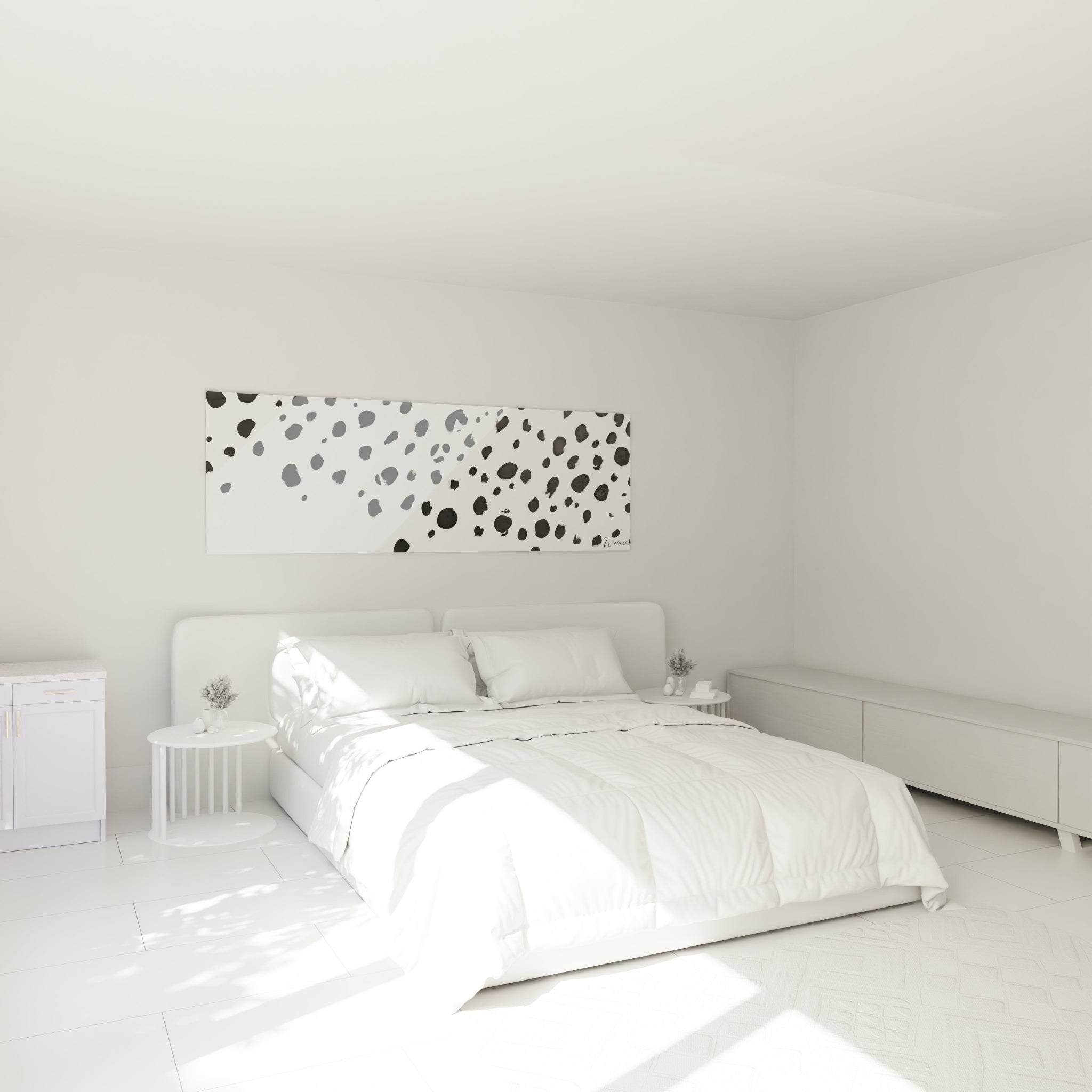 Tableau tacheté noir et blanc Walensky suspendu au-dessus d'un lit dans une chambre lumineuse