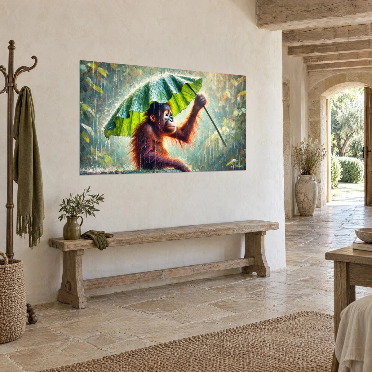 Wall art of a young primate with copper-coloured fur holding a broad anise-green leaf, turquoise background, on a stone wall