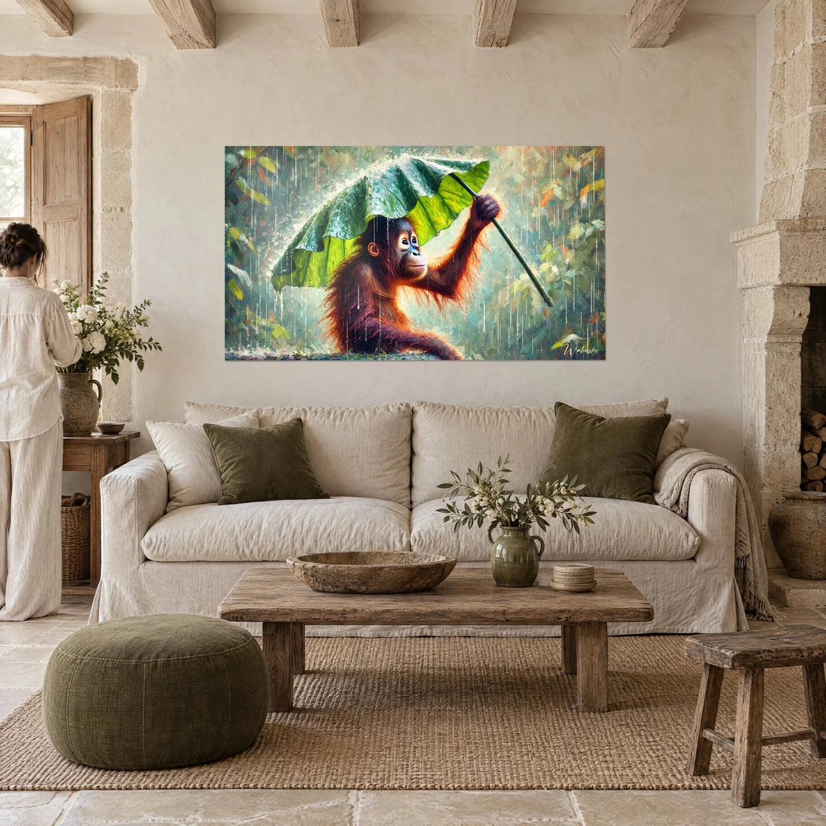 Wall art of a ginger orangutan sheltering under a giant green leaf in tropical rain, above a sofa in a bright living room