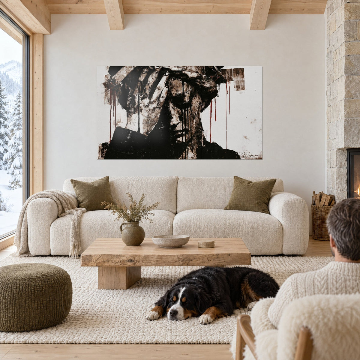 Quadro di un busto velato con colature rosso sangue, seppia e nero su sfondo bianco, cane sdraiato, sopra un divano in un soggiorno luminoso
