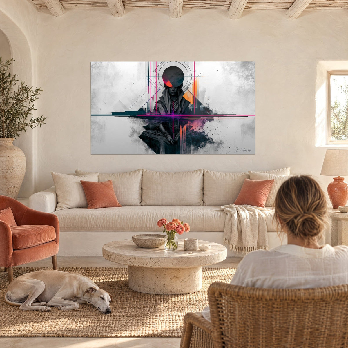 Wall art of a hooded silhouette in charcoal grey, black disc halo and fuchsia lines, hanging above a sofa in a bright living room