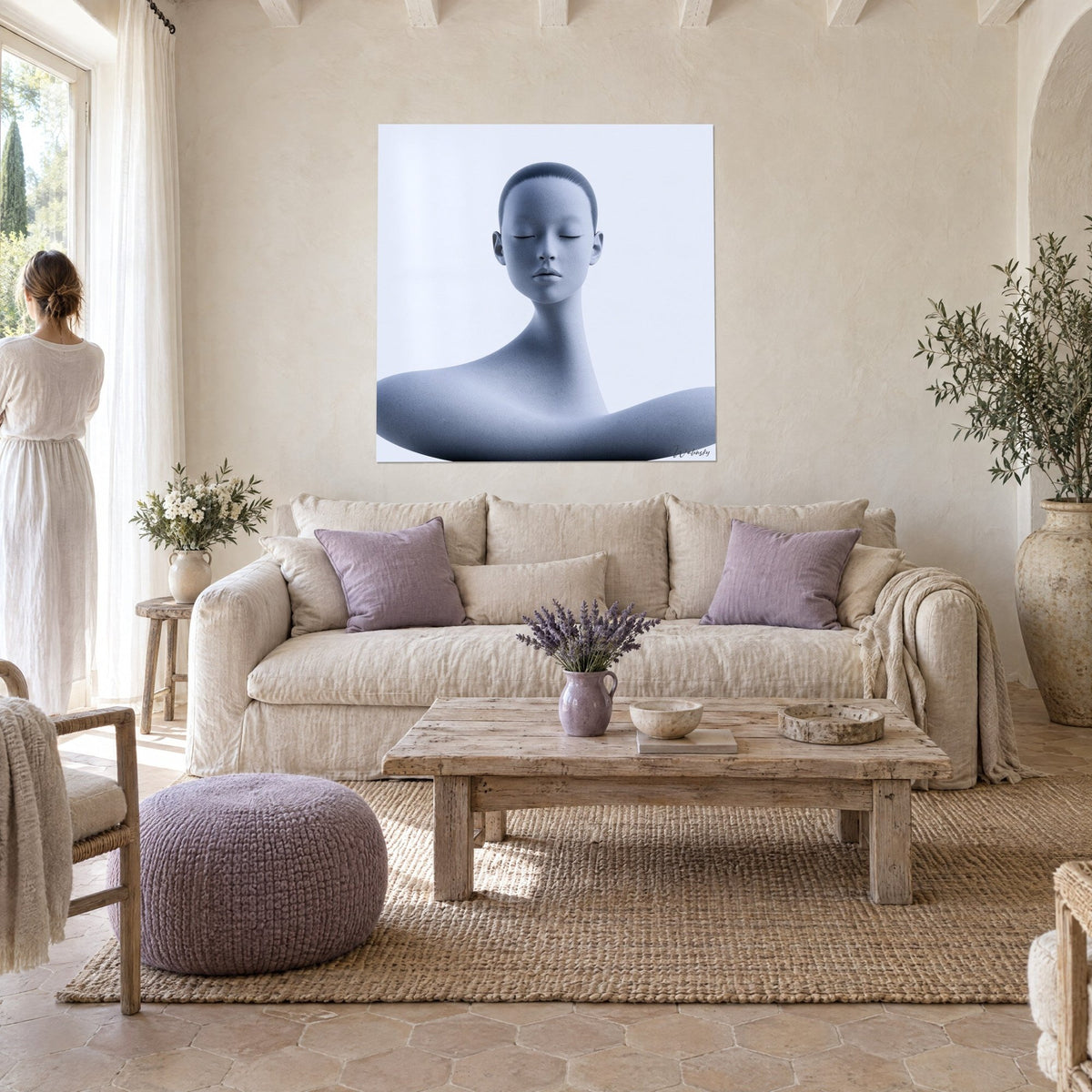 Wall art smooth bust with closed eyelids, grey-blue and white, curved shoulder, above a sofa in a bright living room