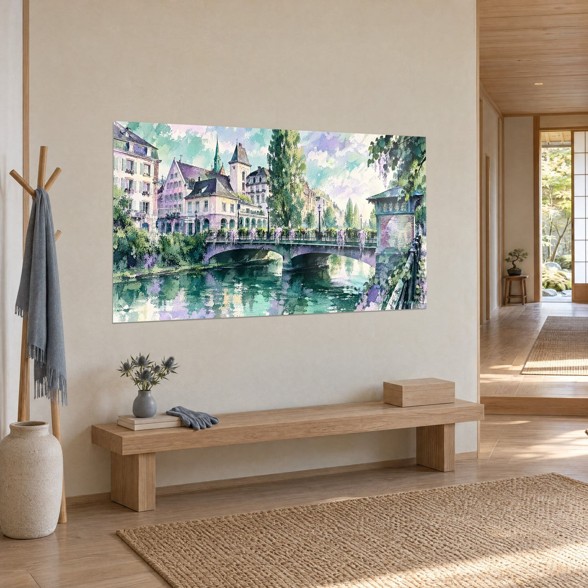 Wall art in watercolour of an emerald canal reflecting pink gabled houses and a green bell tower, three-quarter view in the japandi entryway