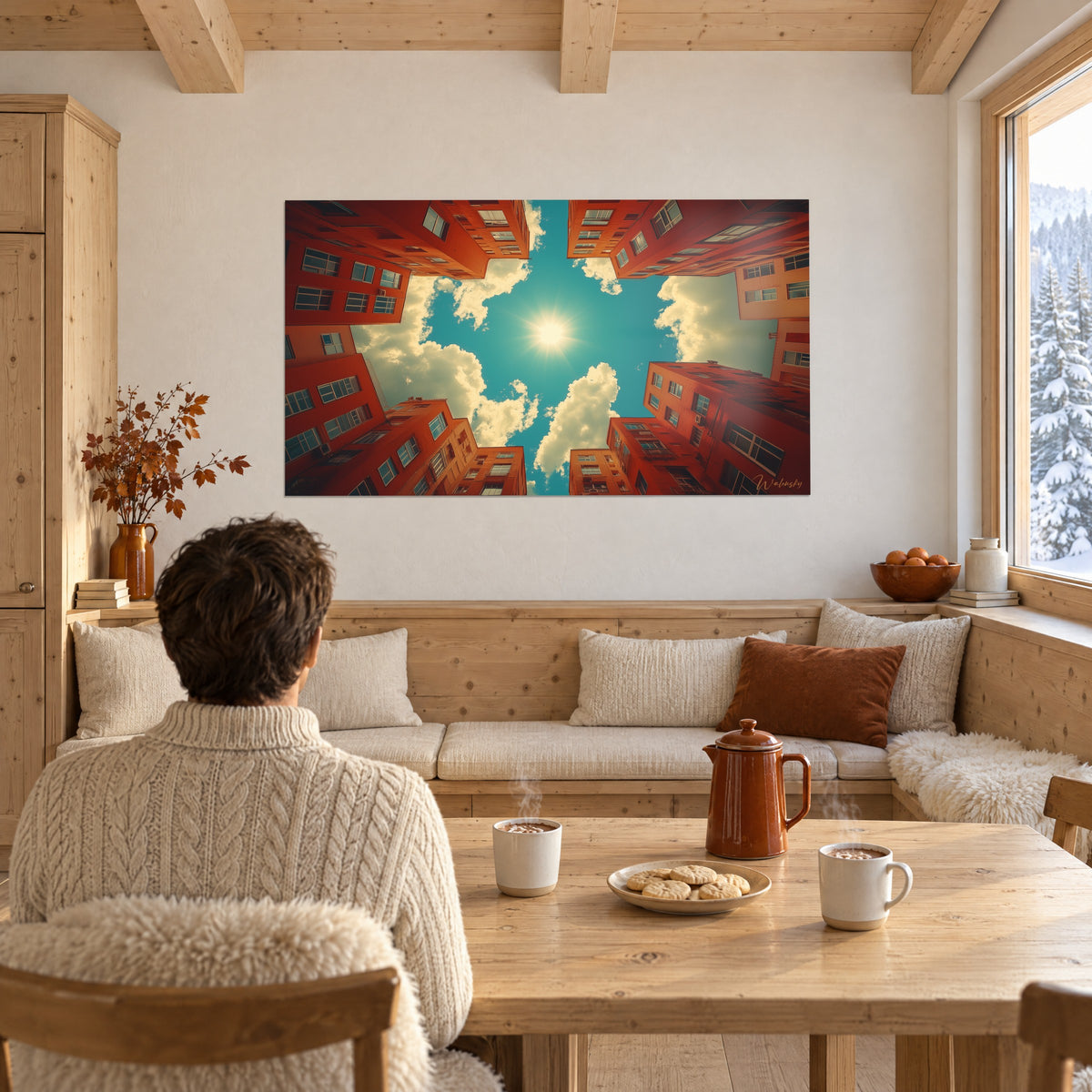 Cuadro perspectiva vertiginosa de fachadas bermellón alrededor de un cielo turquesa, sol estrellado, hombre de espaldas junto a una mesa de madera