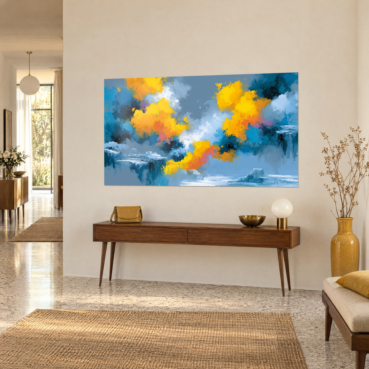 Wall art of abstract bursts of orange and yellow against a grey-blue sky, ice blocks, hanging above a wooden console