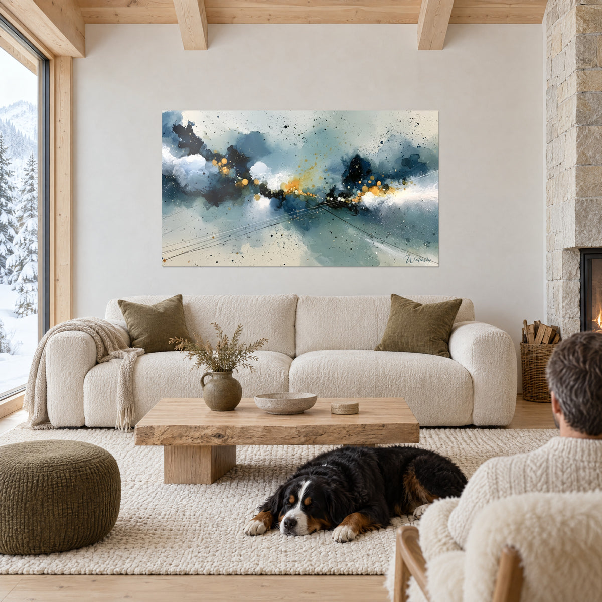 Wall art of a bursting navy-blue cloud, golden splashes on a grey-green ground, black dog lying on a sofa beneath it in a bright living room