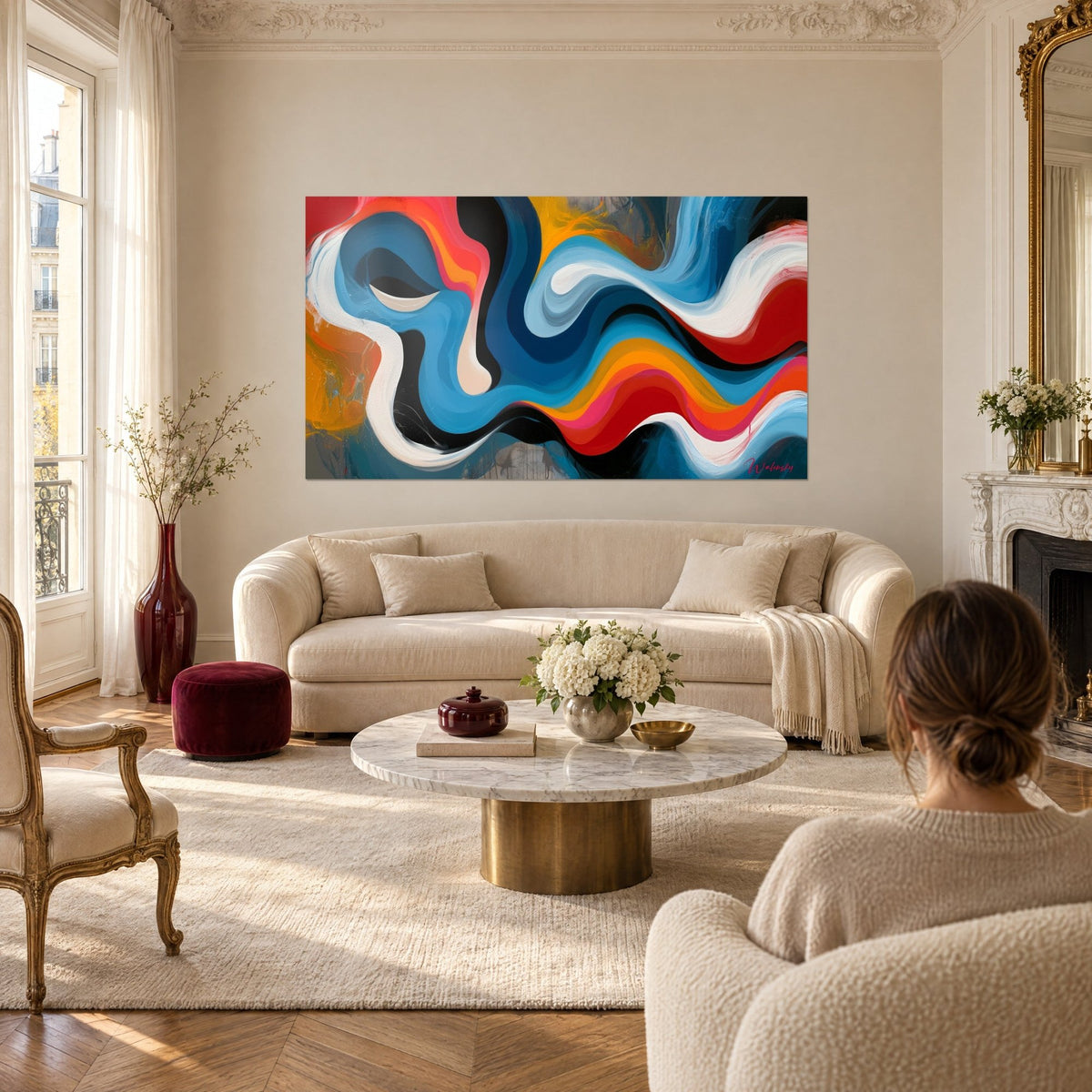 Wall art with sinuous waves in azure blue and carmine red on a black background, two white ripples, above a sofa in a bright living room