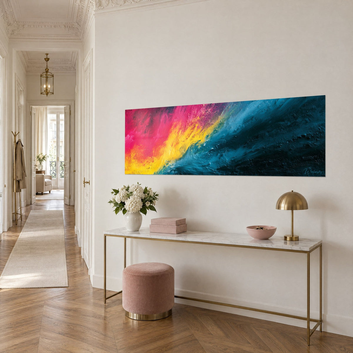 Wall art with magenta and lemon-yellow paint flows shifting into midnight blue, rich in texture, above a gilded console, three-quarter view