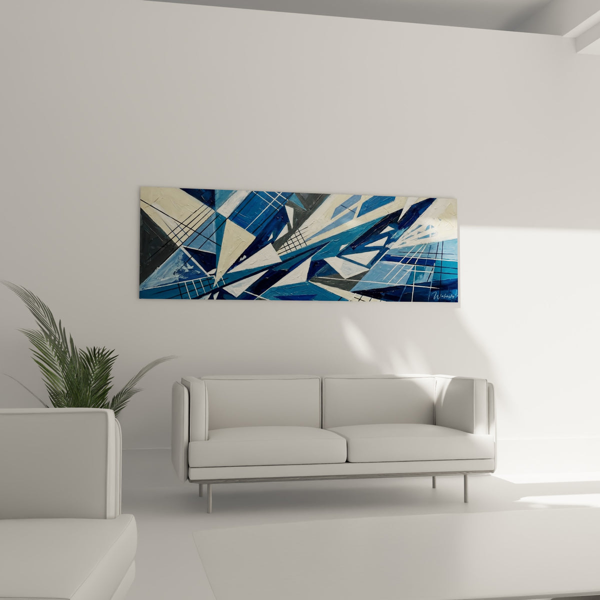 Triangles ivoire et bleu marine formant une composition dynamique, suspendus au-dessus d'un canapé dans un salon lumineux.