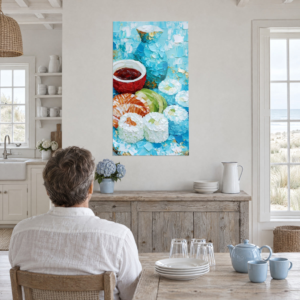 Wall art of creamy nigiri, dark soy sauce in a red bowl and aquamarine carafe, hung in an open kitchen overlooking the dunes