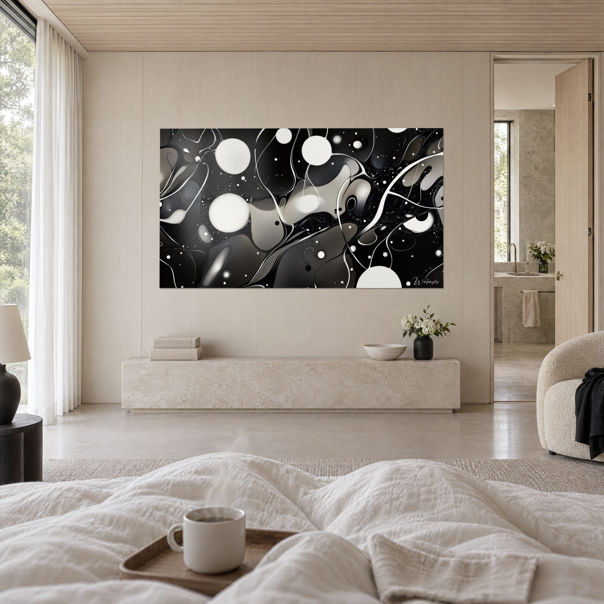 Wall art nebula of white circles and pearl-grey pools on a deep black background, above a bed in a bright bedroom