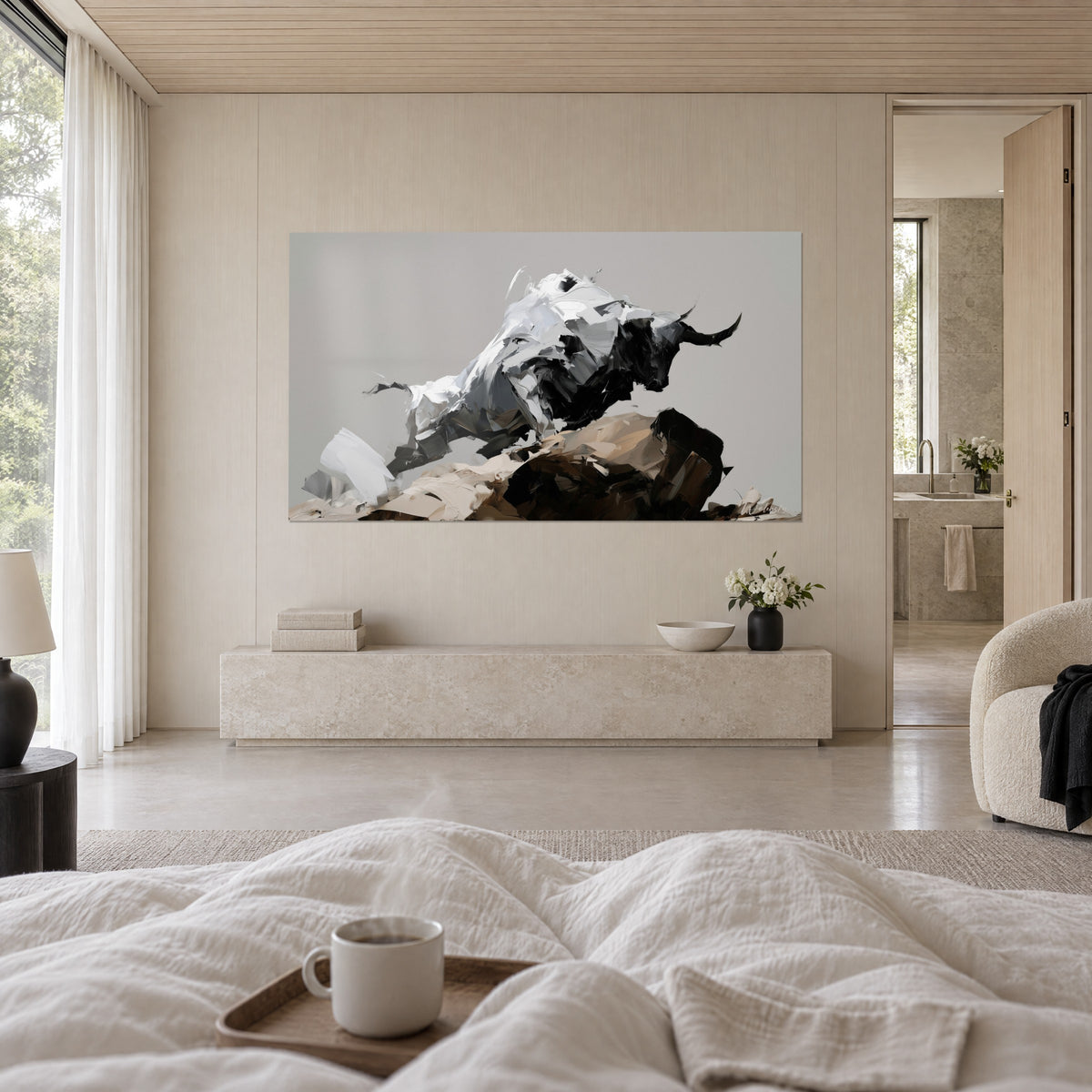 Wall art of a massive buffalo in off-white and charcoal black impasto, curved horns, sand and brown rock, above a bed in a light bedroom