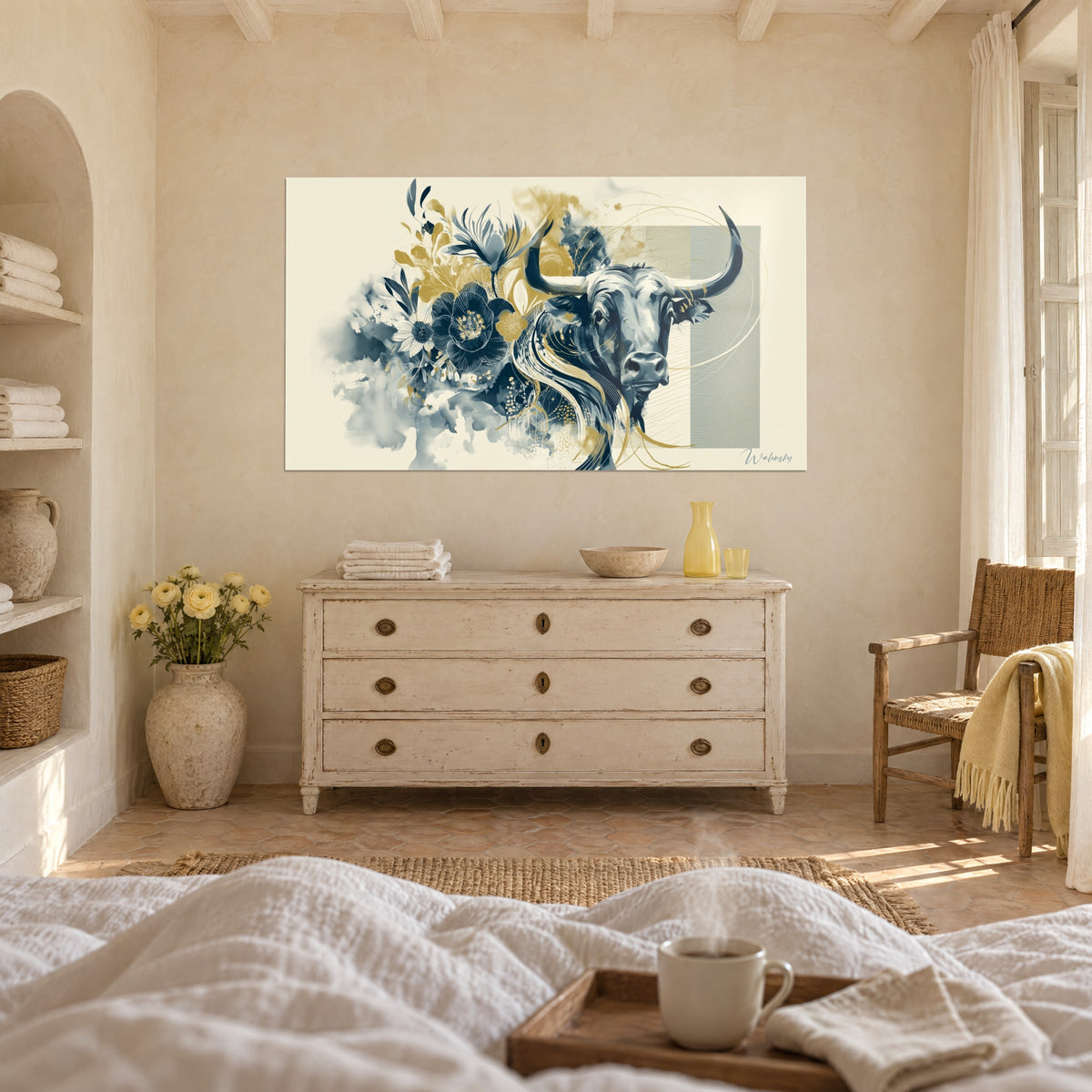 Wall art of a horned animal framed by midnight blue blossoms and ochre gold leaves, above a bed in a light bedroom