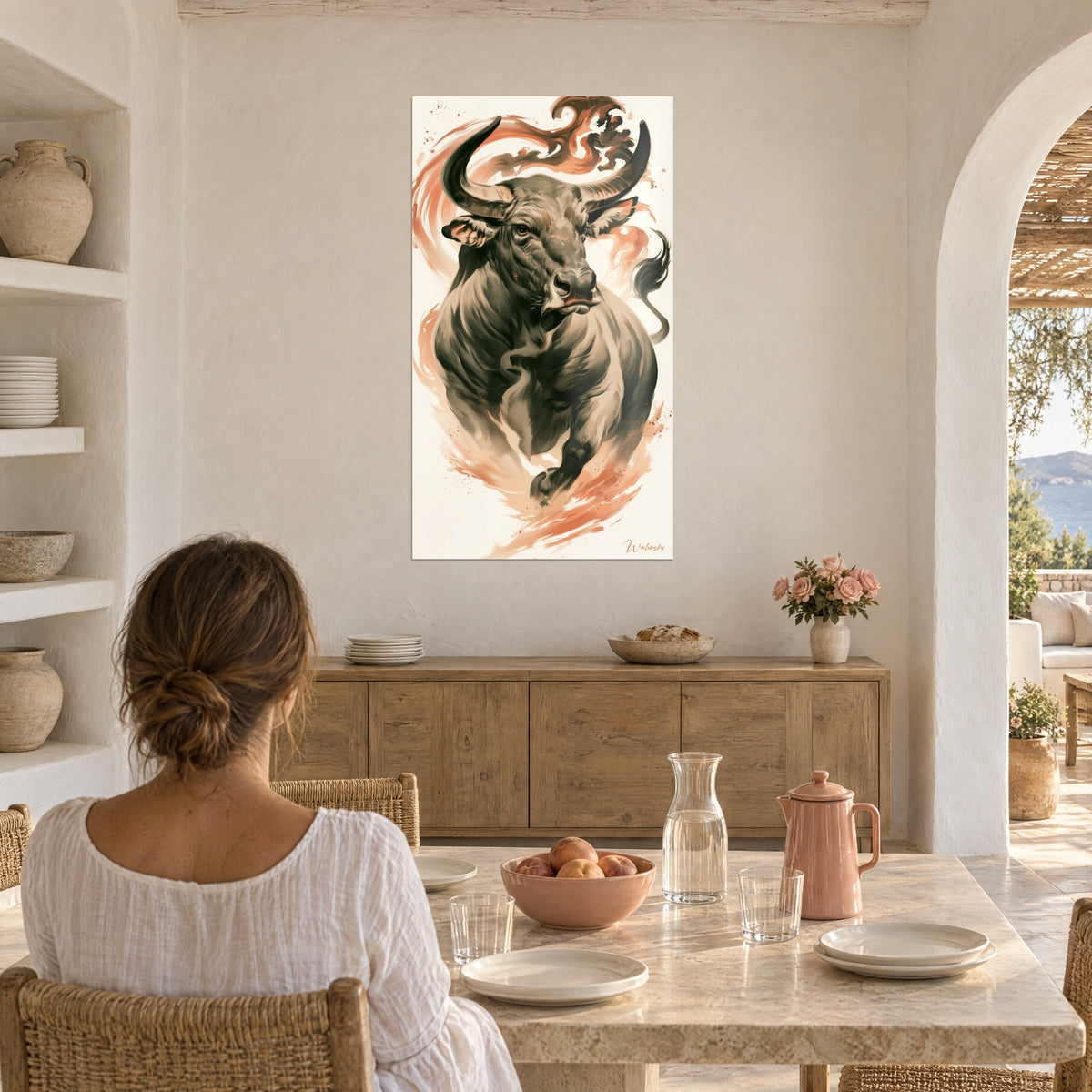 Wall art horned beast in grey ink and salmon streaks on ivory background, facing a light stone table, arch and sea in the distance