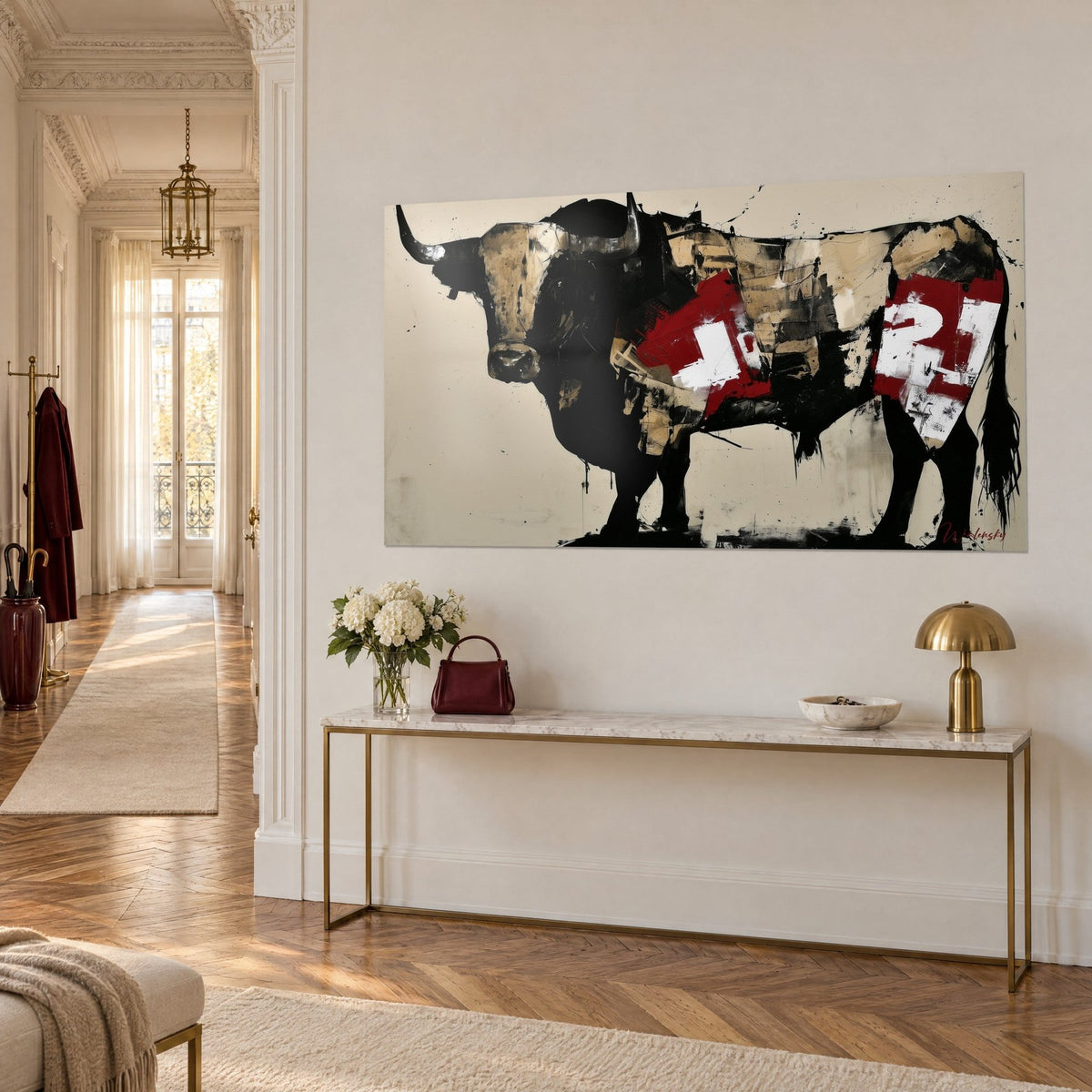 Wall art solid bull in black ink, torn paper in carmine red and sand, white numerals, gilded console, Haussmann corridor