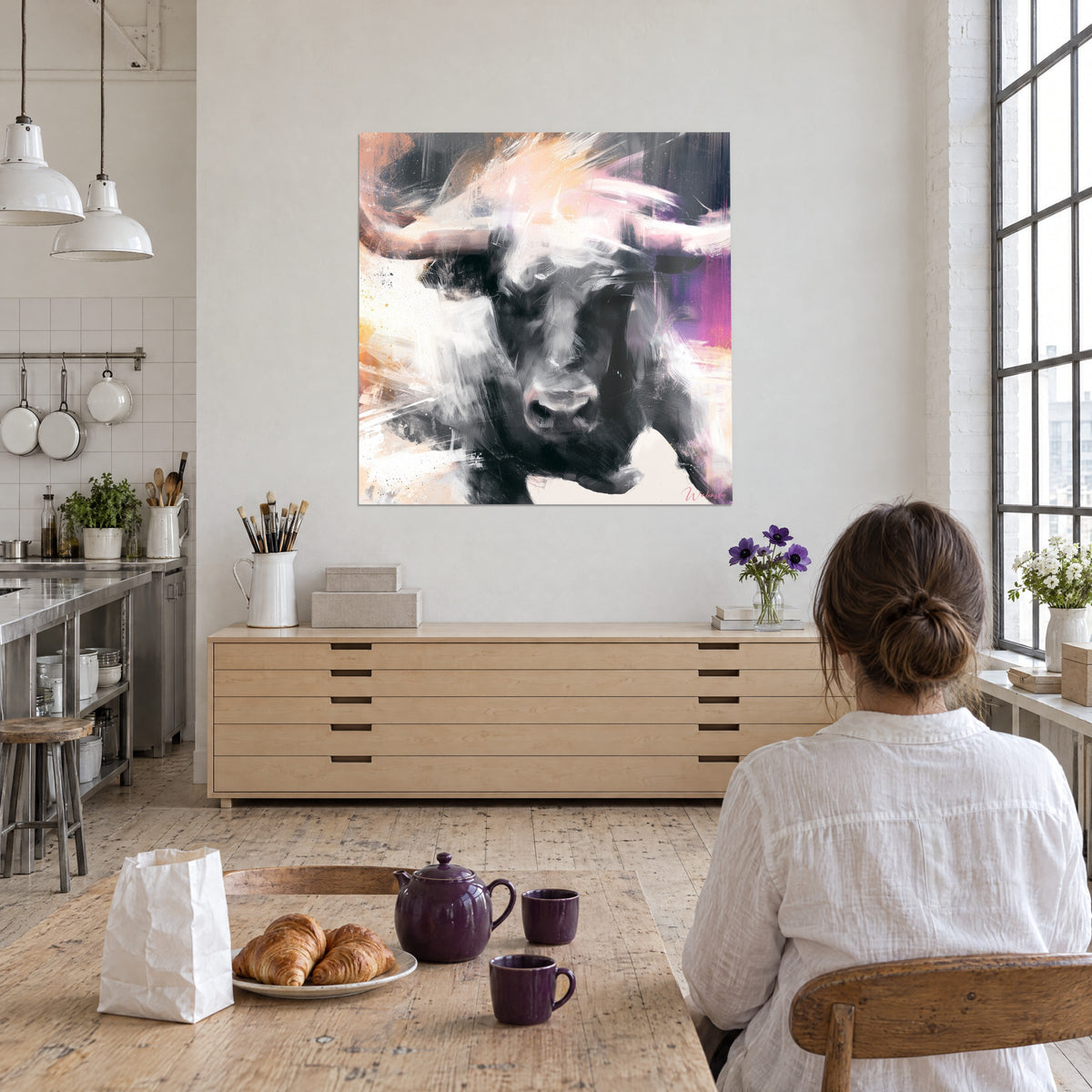 Wall art Charcoal buffalo with cream and fuchsia streaks, a woman seen from behind in front, open kitchen of an artist's loft