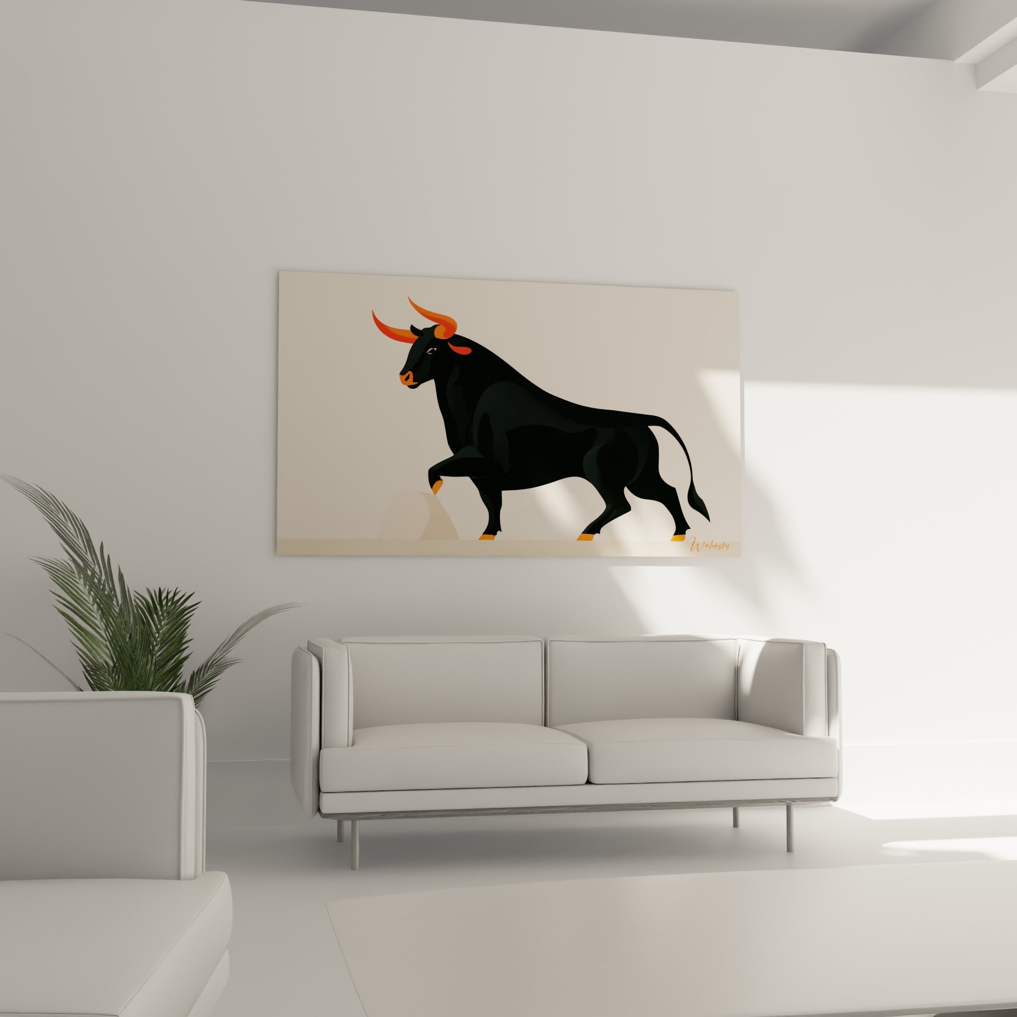 Animal graphique noir aux cornes orange placé au-dessus d'un canapé dans un salon lumineux
