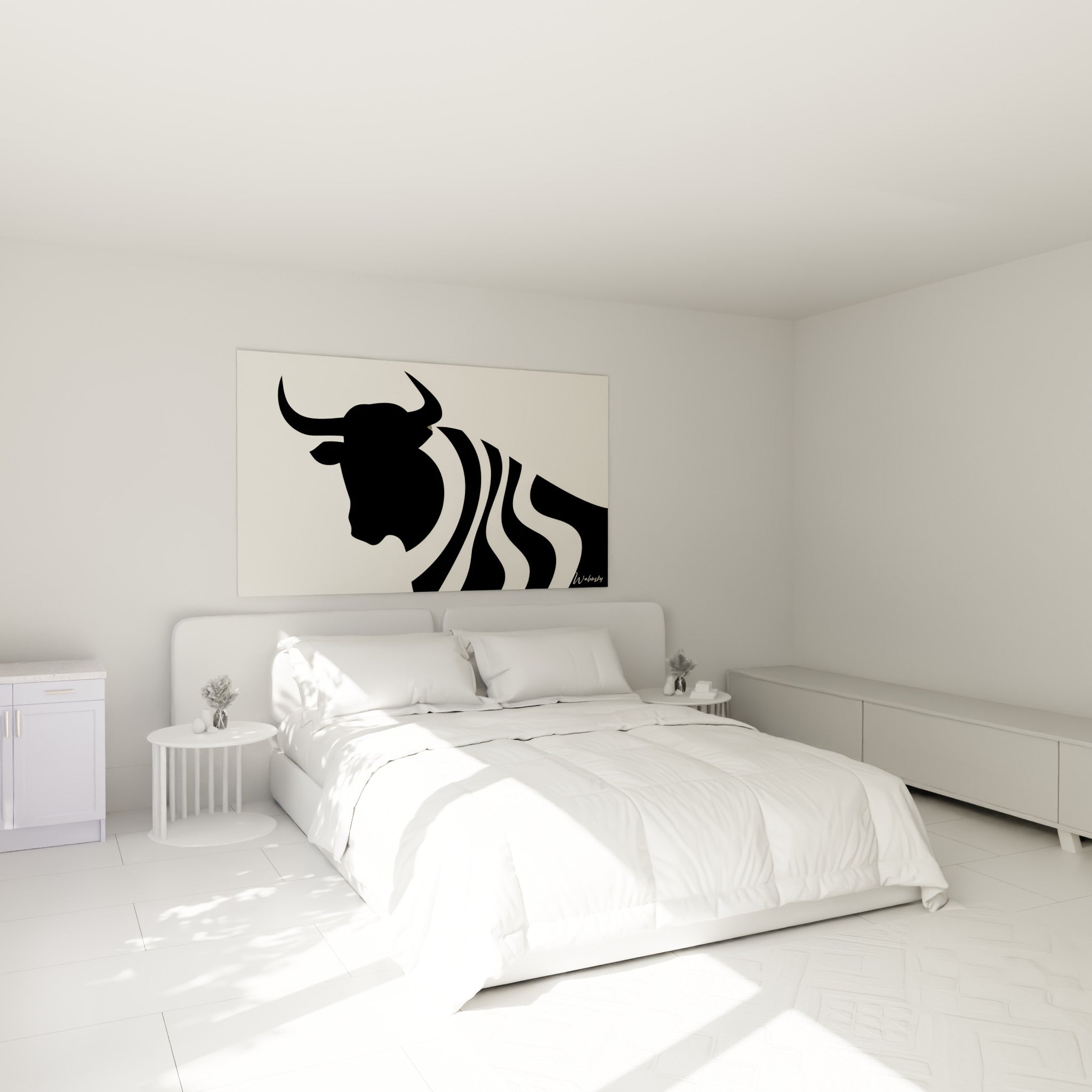 Silhouette du taureau noir et ivoire accrochée au-dessus d'un lit dans une chambre claire.