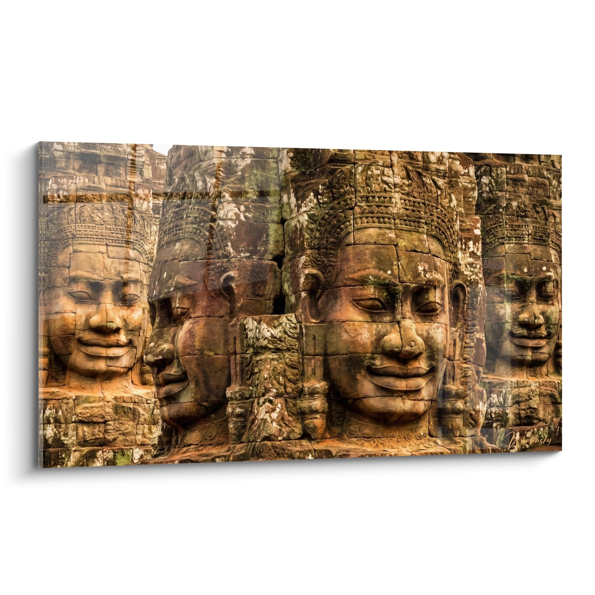 Tableau temple bouddhiste visages sculptés pierre tons ocre dorés expressions sereines meditation