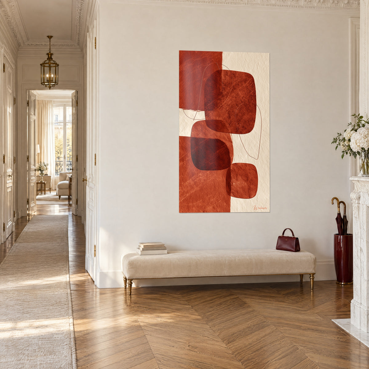 Wall art with organic shapes in terracotta and ivory on textured paper, at the end of a hallway with parquet floors, three-quarter view