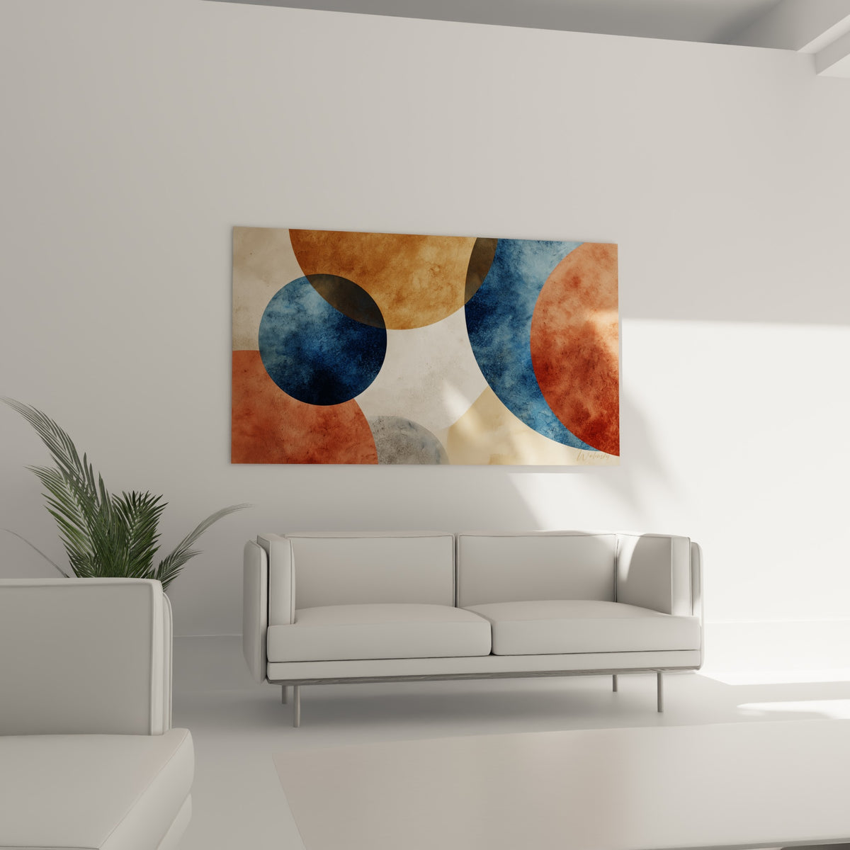 Formes rondes terracotta et bleu marine en dégradé, disposées au-dessus d'un canapé dans un salon lumineux
