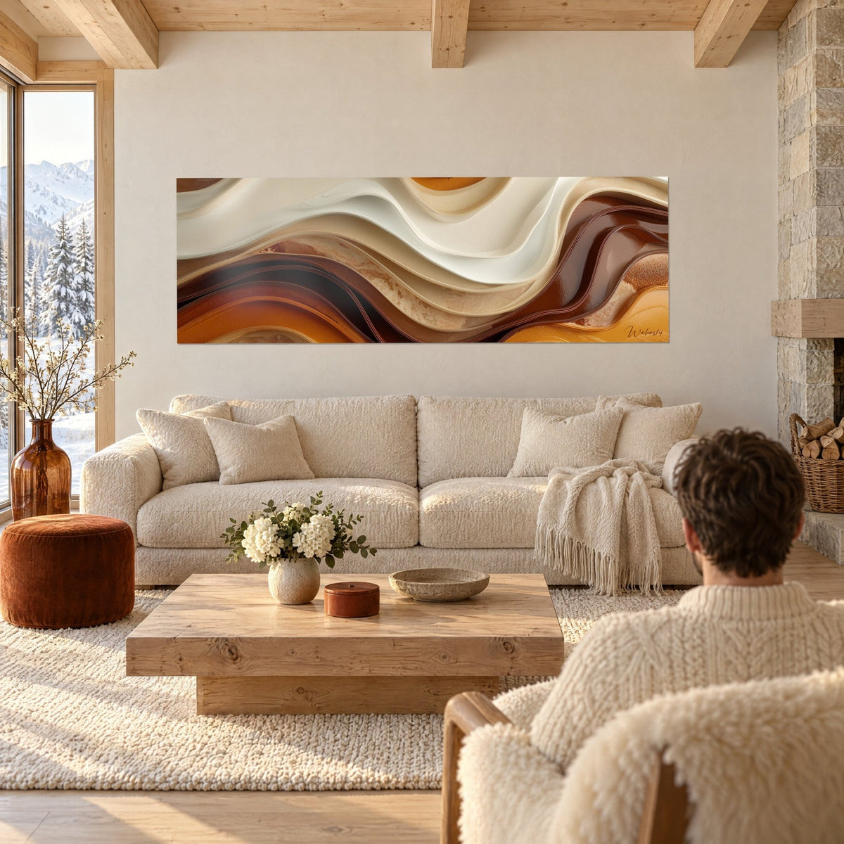 Wall art of sinuous ivory and copper-brown waves with satin sheen, couple seen from behind, above a sofa in a bright living room