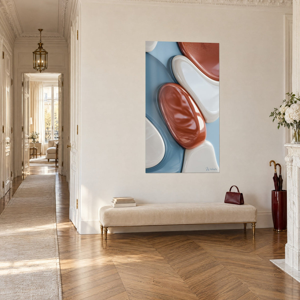 Wall art with glazed stones in terracotta and ivory overlapping on a powdery blue, seen three-quarter view at the end of a Haussmann-style hallway