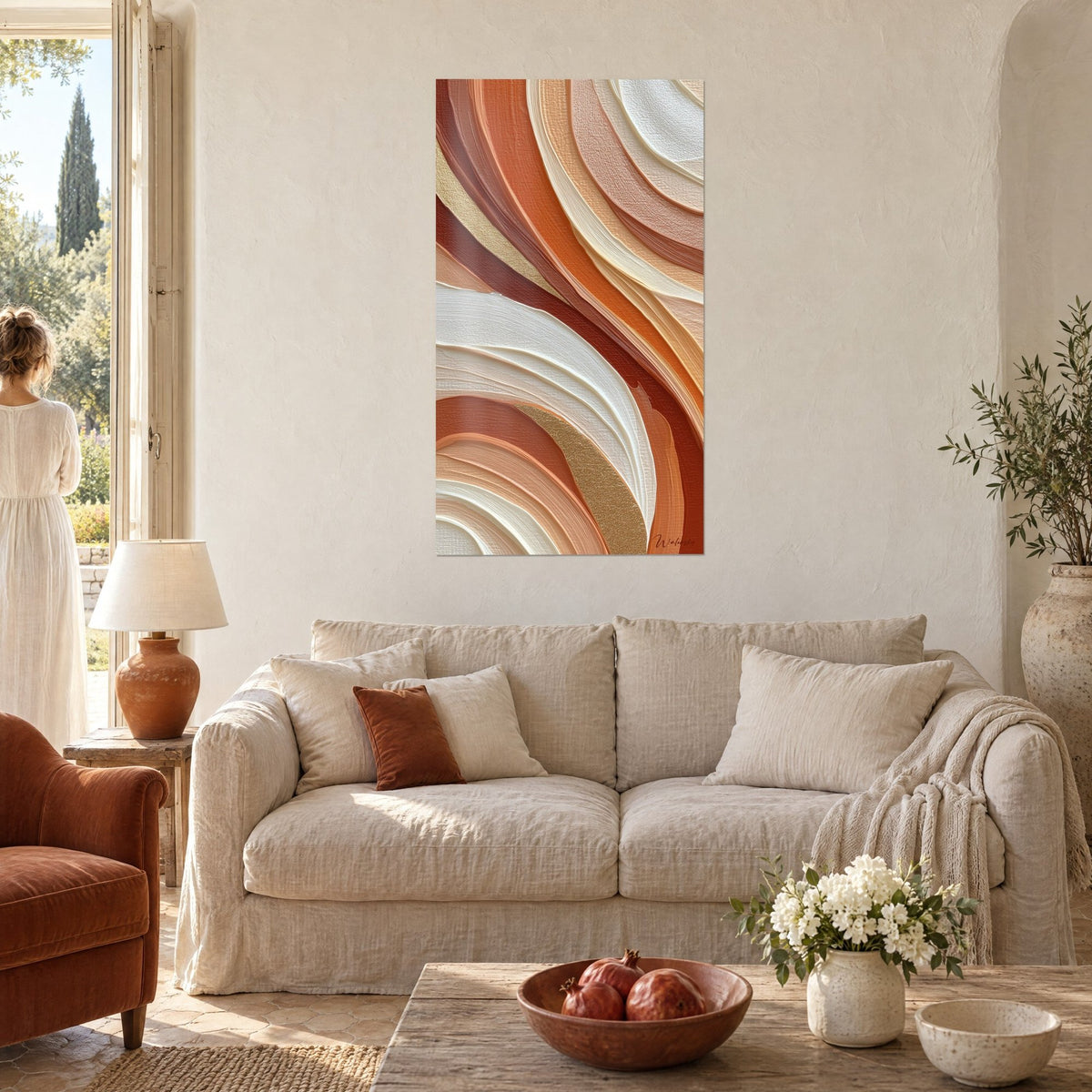 Wall art with sculpted waves in orange and cream, raised golden swirls, two people seen from behind, above a sofa in a bright living room