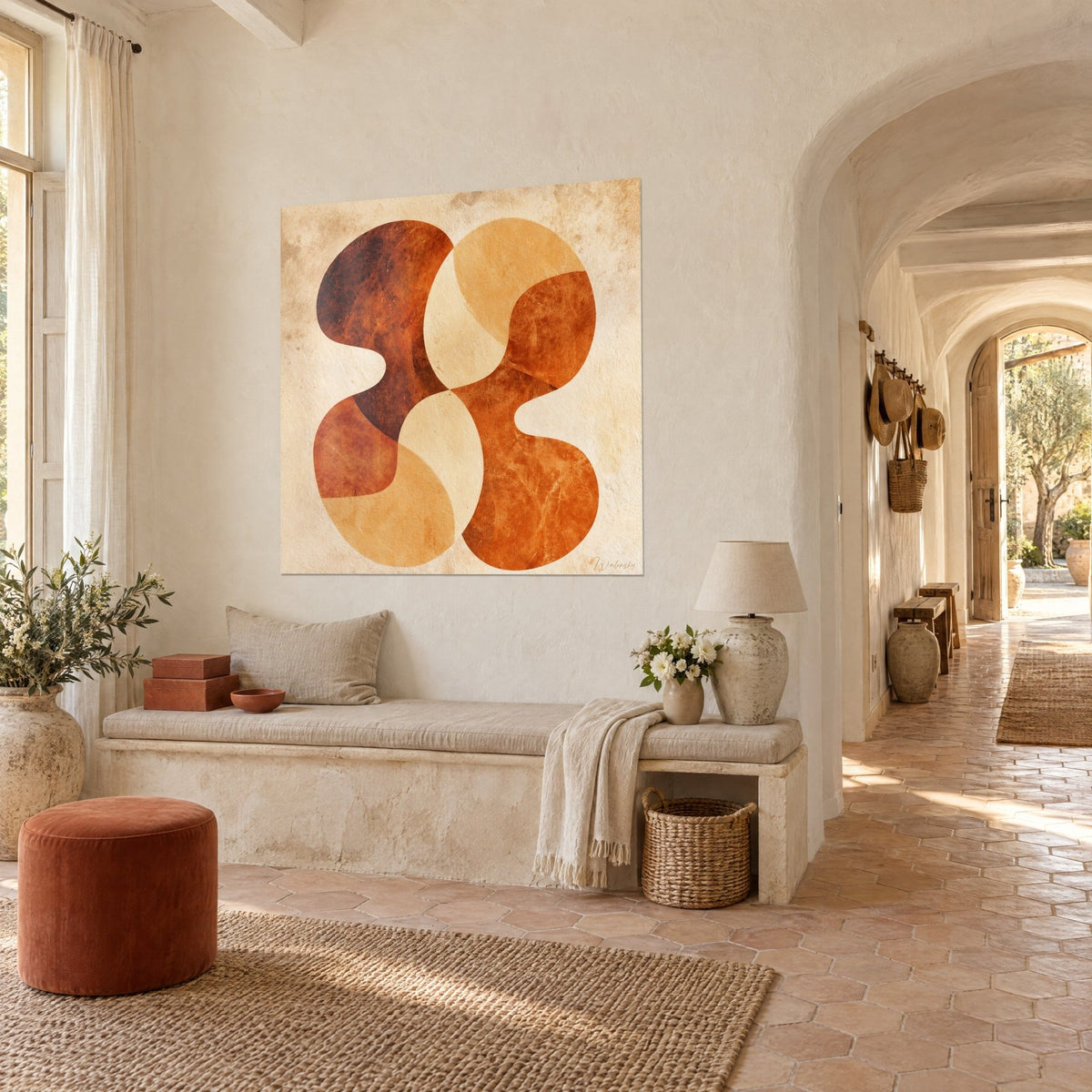 Wall art with an organic motif of amber and burnt orange lobes, three-quarter view of a rendered wall, stone bench and vaulted corridor