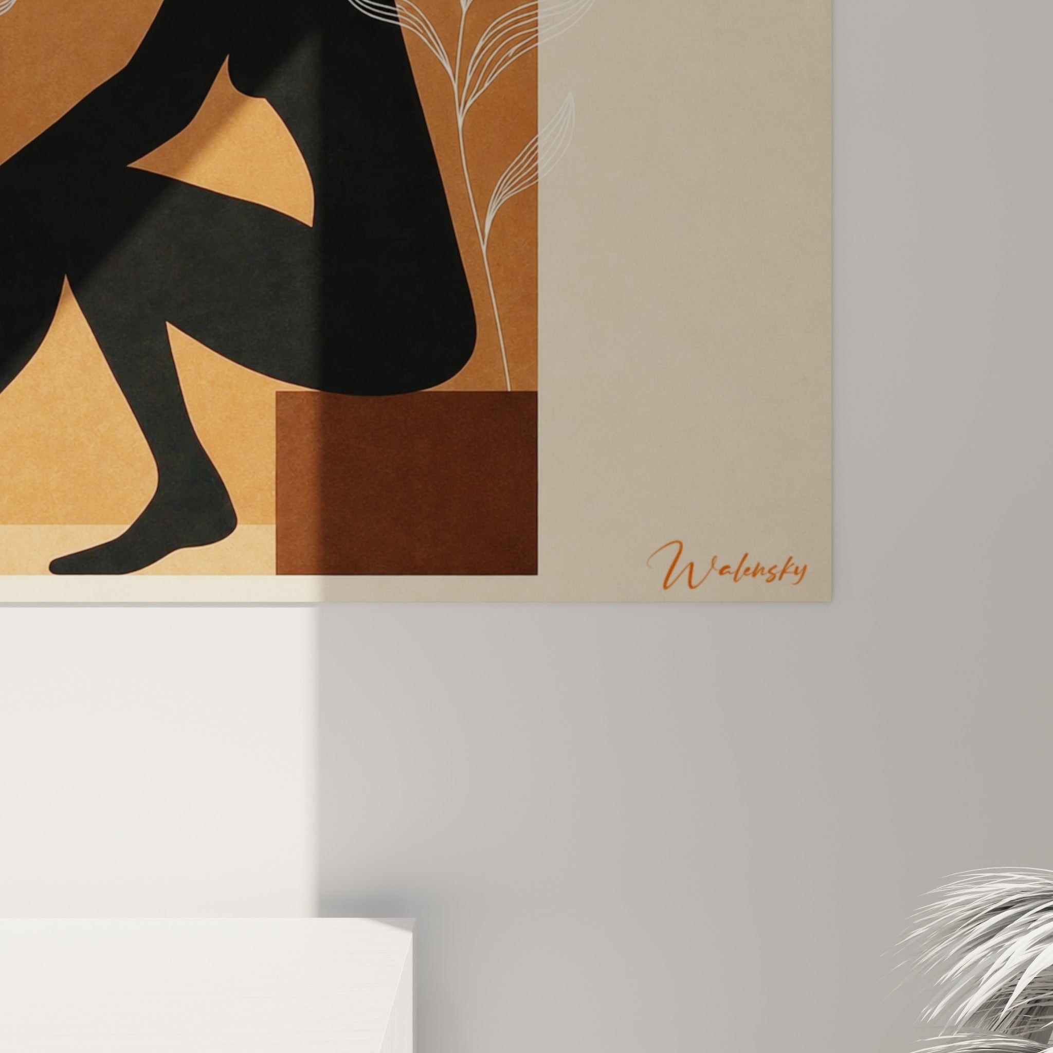 Détail des traits fins blancs et des teintes terracotta, brun et beige sur la toile encadrée