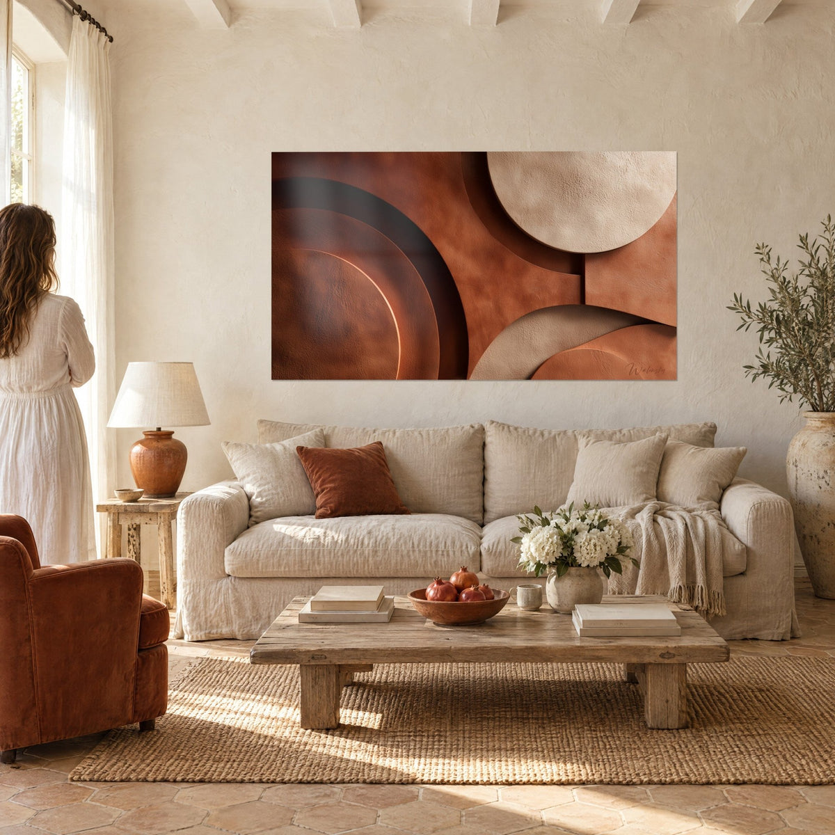 Wall art with stacked terracotta and sand discs, glowing copper crown, hung above a sofa in a bright living room