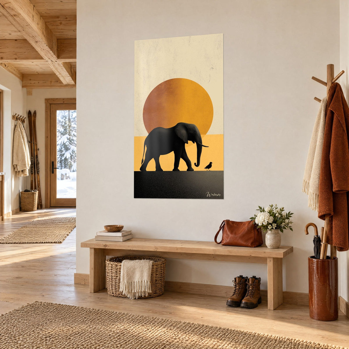 Wall art elephant silhouette in charcoal, burnt orange sun and tiny bird, hung in a light wood chalet hallway