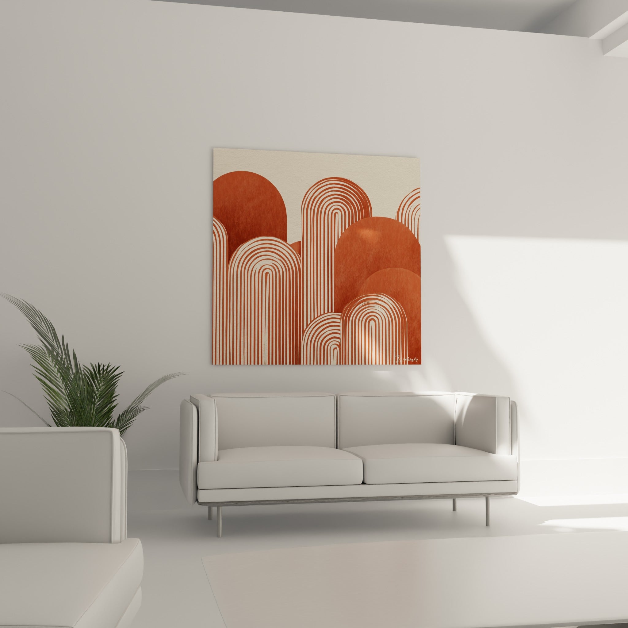 Formes voûtées terracotta et crème rythmées par des rayures accrochées au-dessus d'un canapé dans un salon lumineux