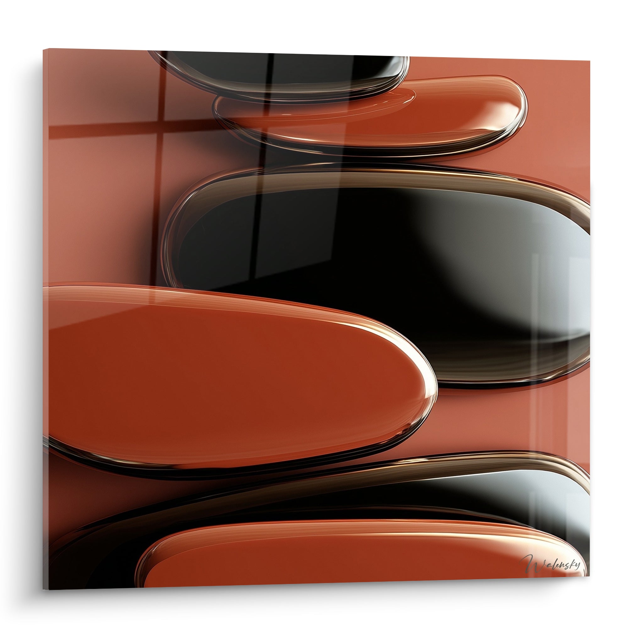 Galets empilés terracotta et noir laqué aux reflets brillants sur fond quadrillé orangé