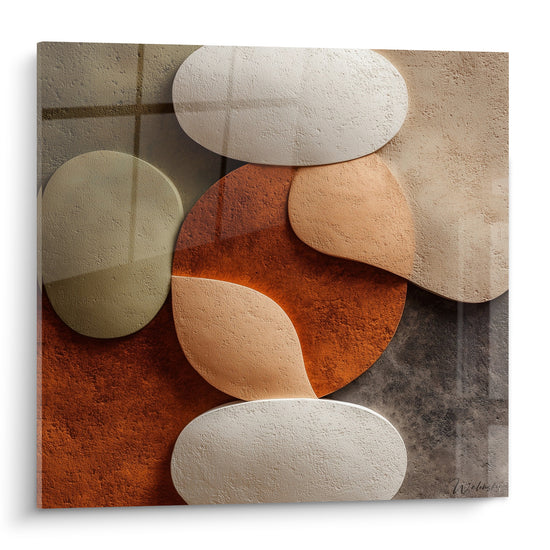 Galets sculptés terracotta et blanc crème empilés en équilibre sur fond gris texturé