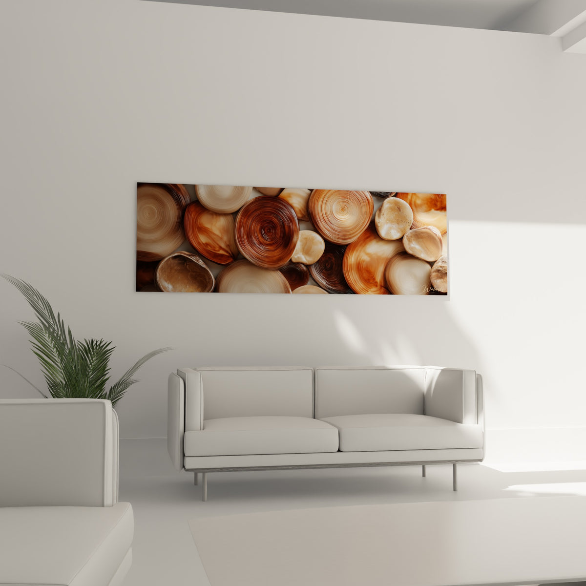 Formes ovales brunes et ocre aux motifs circulaires au-dessus d'un canapé dans un salon lumineux