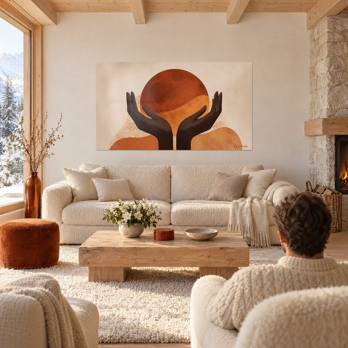 Tableau mains brunes offrant un disque ocre sur fond beige, au-dessus d'un canapé dans un salon lumineux