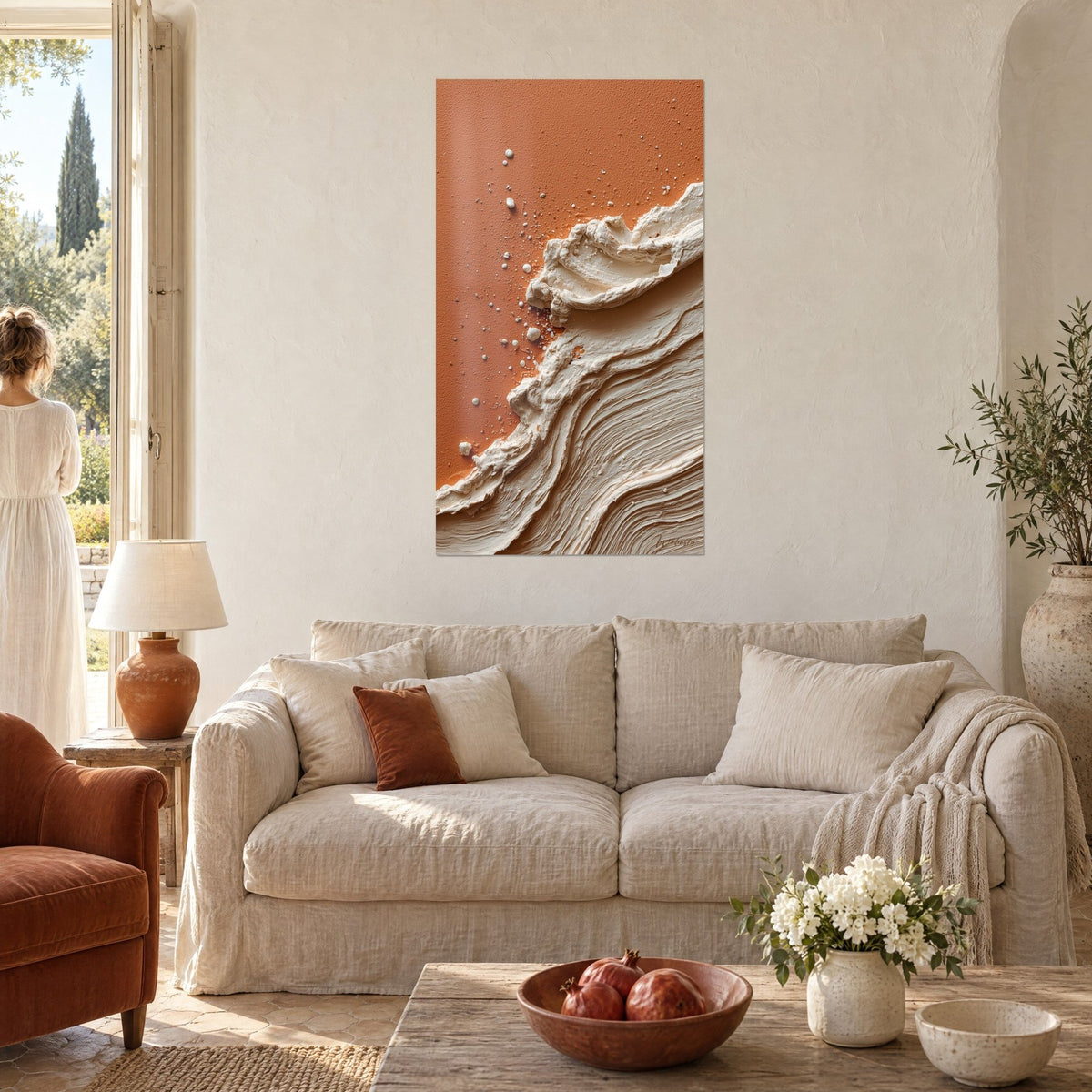 Wall art creamy paste crest on brick background, white splashes, above a sofa in a bright living room