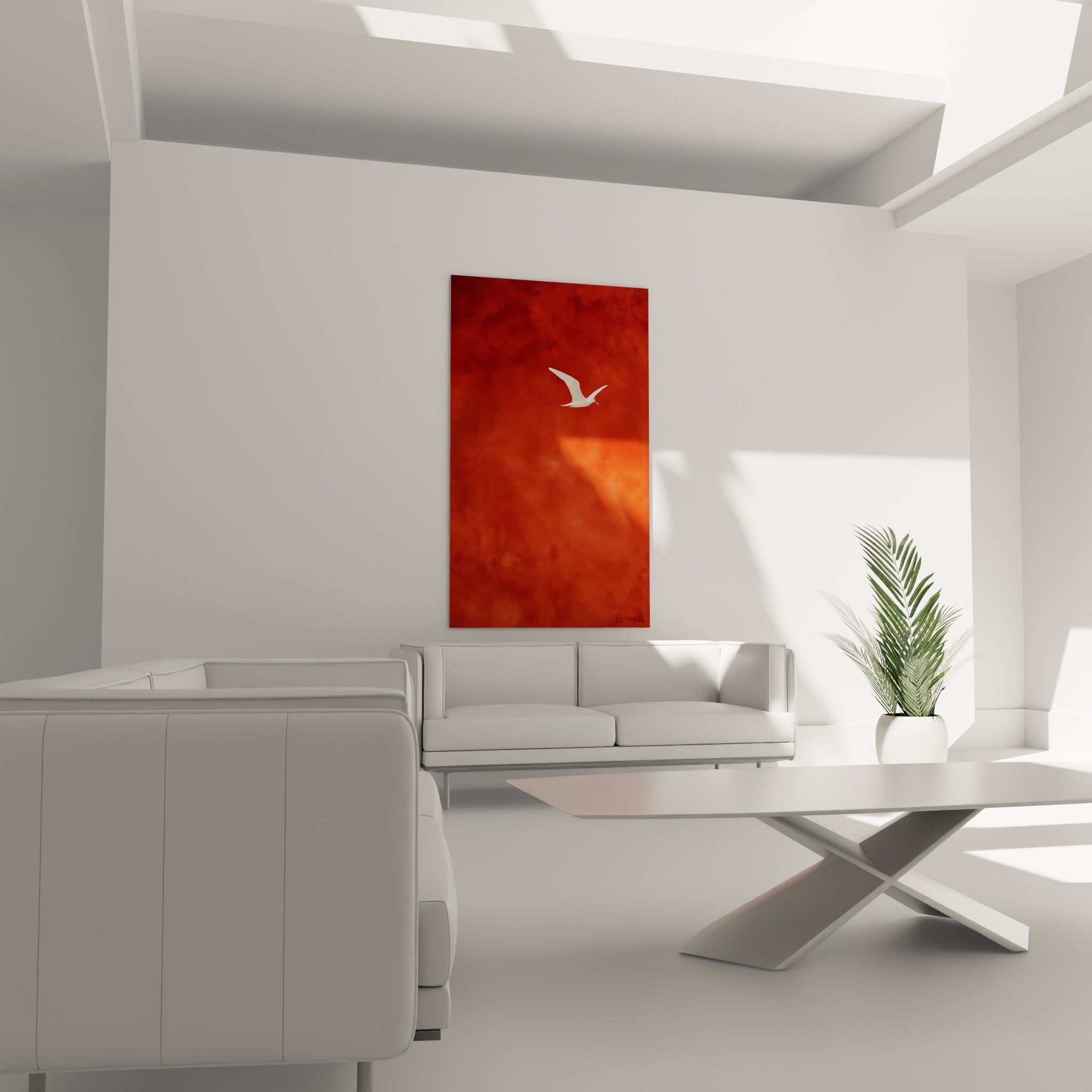 Silhouette d'oiseau blanc traversant un ciel rouge brique, tableau terracotta au-dessus d'un canapé dans un salon lumineux