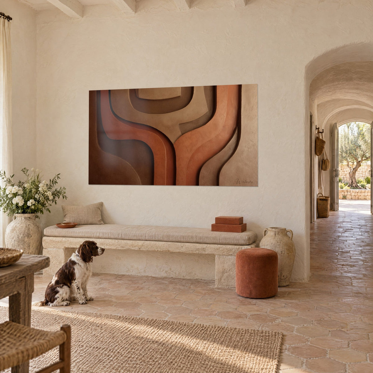 Wall art with rippling ochre and rust clay layers, pale plastered wall, a spaniel sitting on the tiles of a Provençal farmhouse