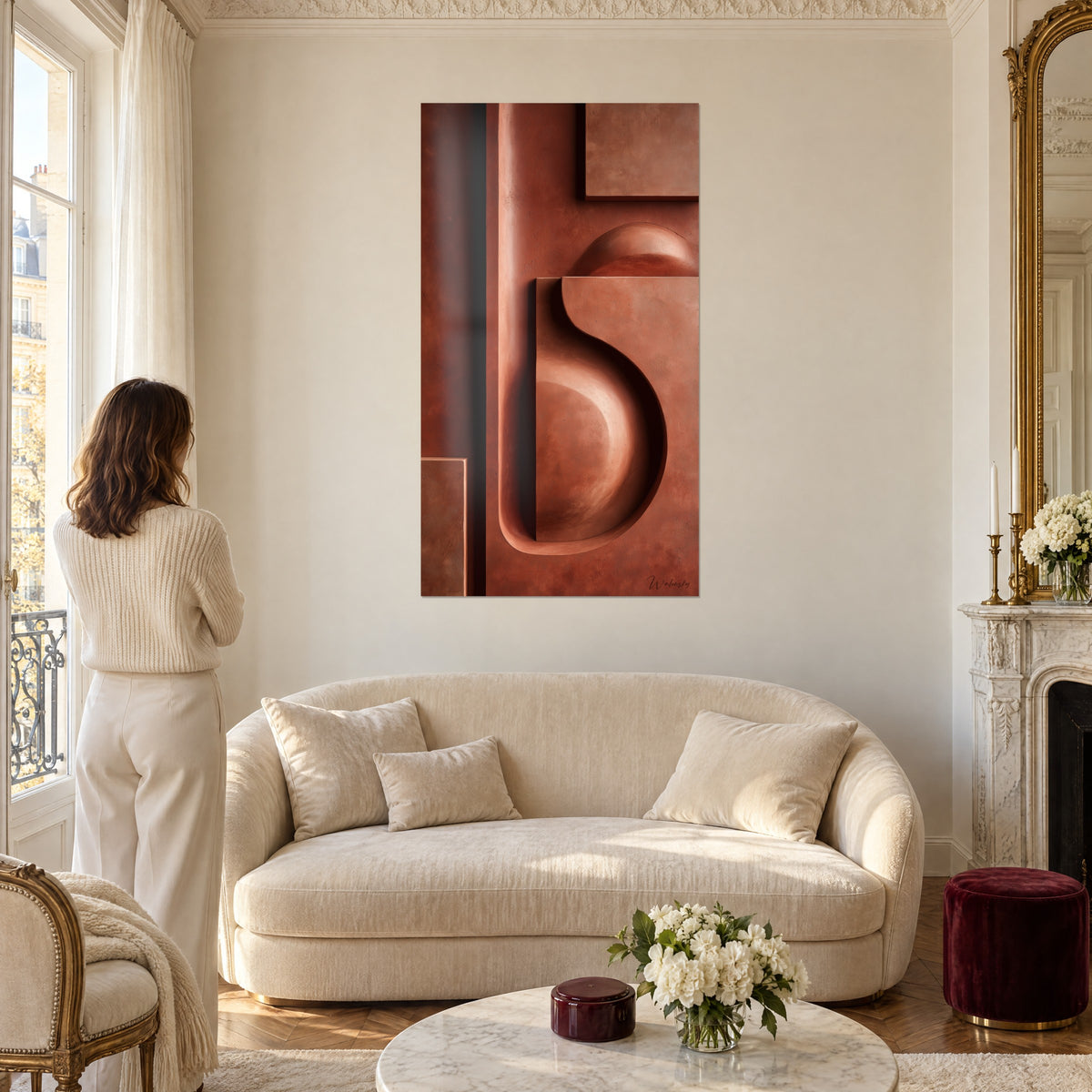 Wall art sculpted relief in brick and copper, hollowed ochre volute, woman seen from behind, above a sofa in a bright living room