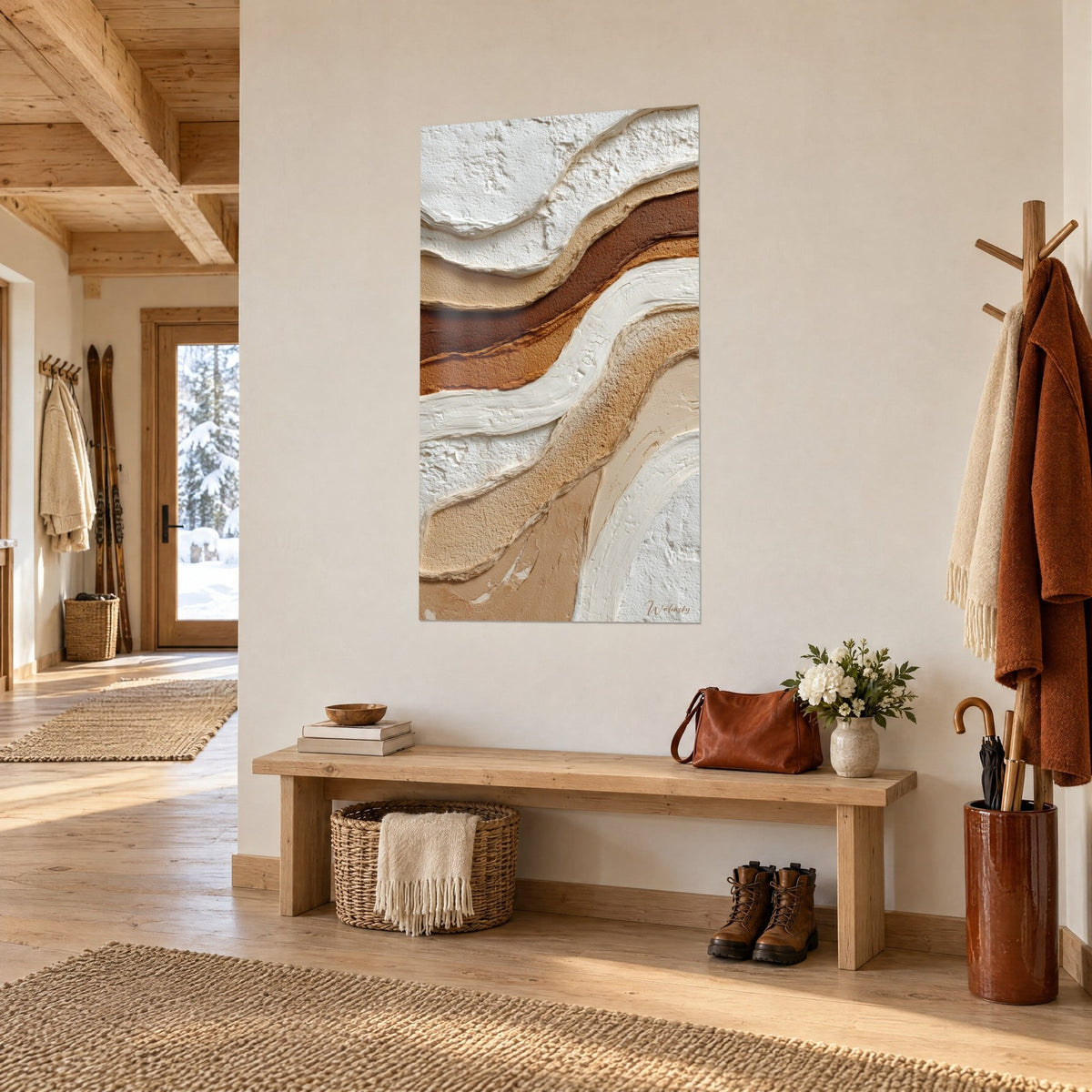 Wall art with undulating layers in ivory and caramel in thick relief, hung near a wooden bench in the entrance of a chalet