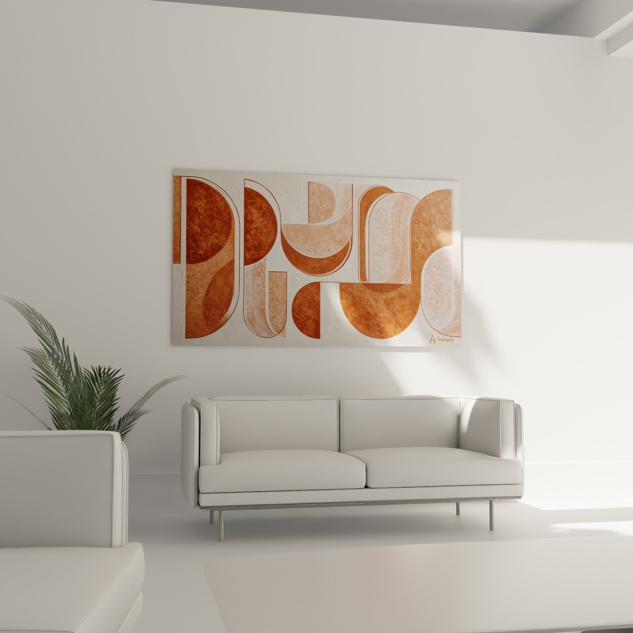 Silhouettes ocre et blanc cassé aux contours nets disposées au-dessus d'un canapé dans un salon lumineux